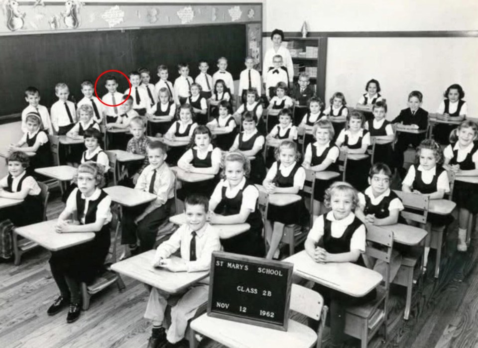 Black and white photo of Robert Prevost, the newly elected Pope, as a young boy in a classroom.