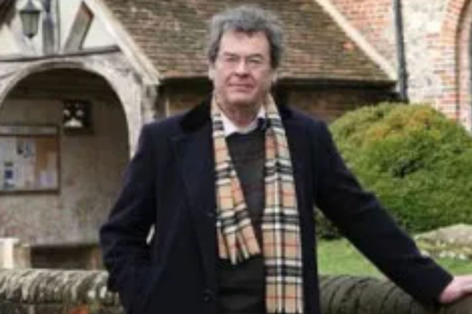 An image collage containing 1 images, Image 1 shows Peter Bassano standing outside a church