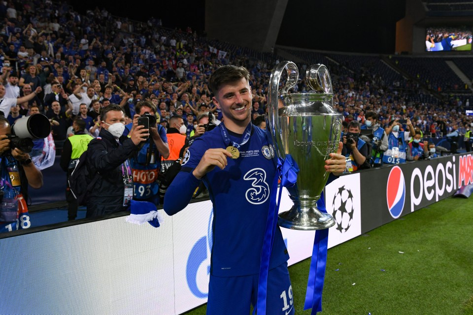 Mason Mount of Chelsea celebrates with the Champions League trophy.