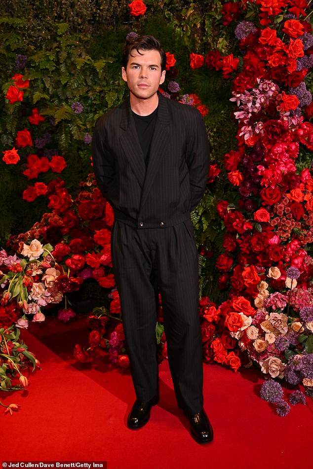 Elsewhere Nicola's co-star Luke Newton looked dapper in a black pinstriped jacket which he teamed with matching trousers