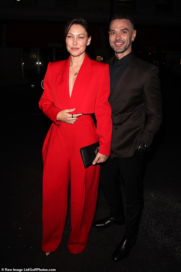 Emma toted her belongings in a black clutch and simply accessorised with a silver pendant necklace while Matt dressed smart in a brown double breasted blazer