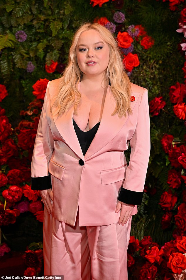 Meanwhile Bridgerton star Nicola cut a stylish figure in a pink blazer and matching wide legged trousers