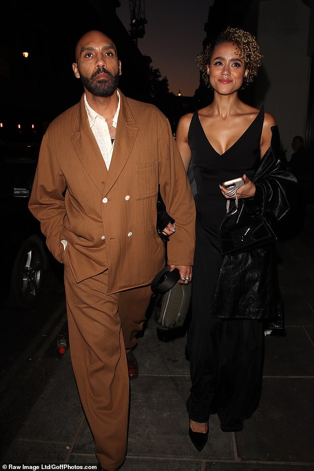 The Game Of Thrones actress was all smiles as she arrived at the bash linking arms with her hunky partner