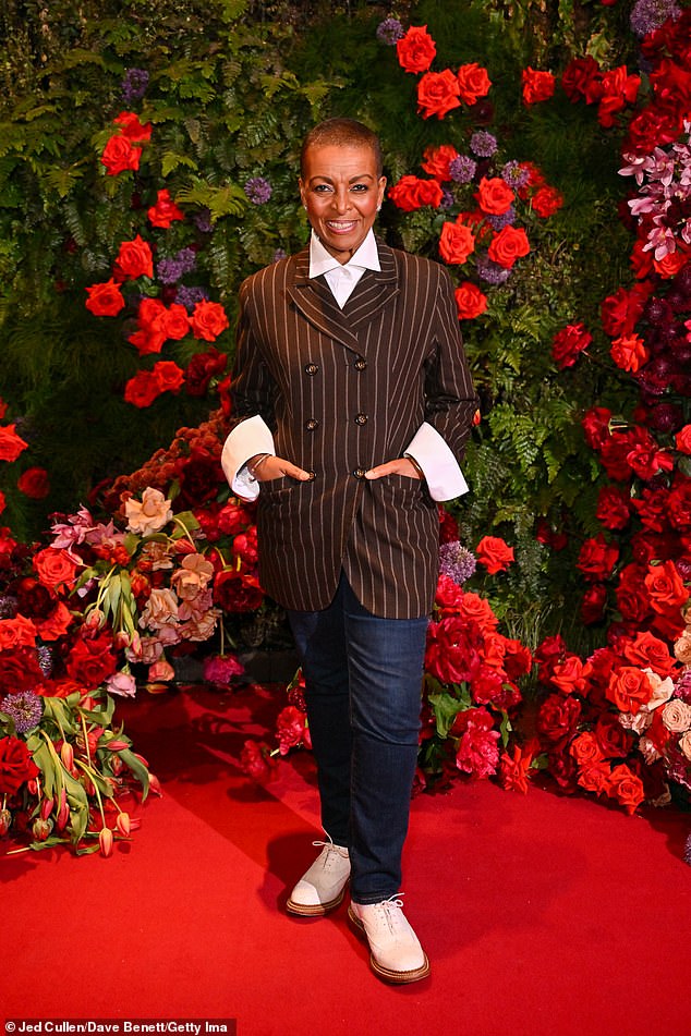 Adjoa Andoh looked chic in a brown striped blazer and blue denim jeans