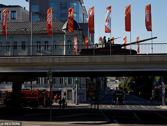 A Russian tank moves along a bridge before a military parade on Victory Day, marking the 80th anniversary of the victory over Nazi Germany in World War Two, in Moscow, Russia, May 9, 2025.
