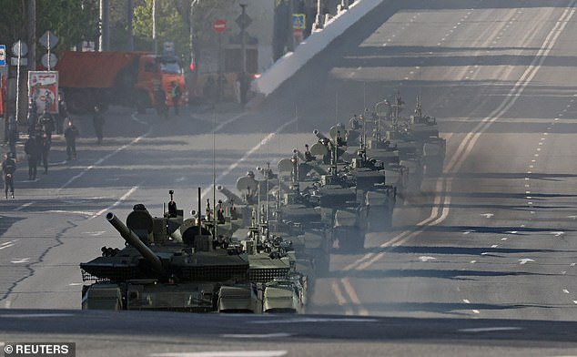 Russian tanks drive along a road before a military parade on Victory Day, marking the 80th anniversary of the victory over Nazi Germany in World War Two, in Moscow, Russia, May 9, 2025
