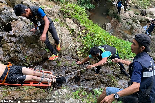Na Mueang Rescue Unit on the island of Koh Samui, Thainland, taking the body of a French tourist up the 260ft high Na Mueang 2 waterfall