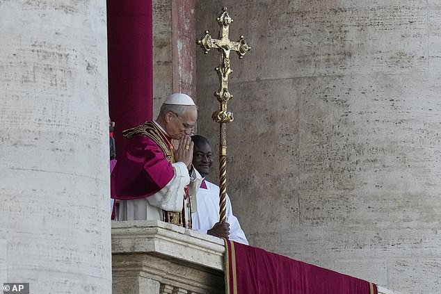 Pope Leo XIV addresses the crowds as he appears on the balcony of St Peter's Basilica after his election, at the Vatican, Thursday, May 8, 2025