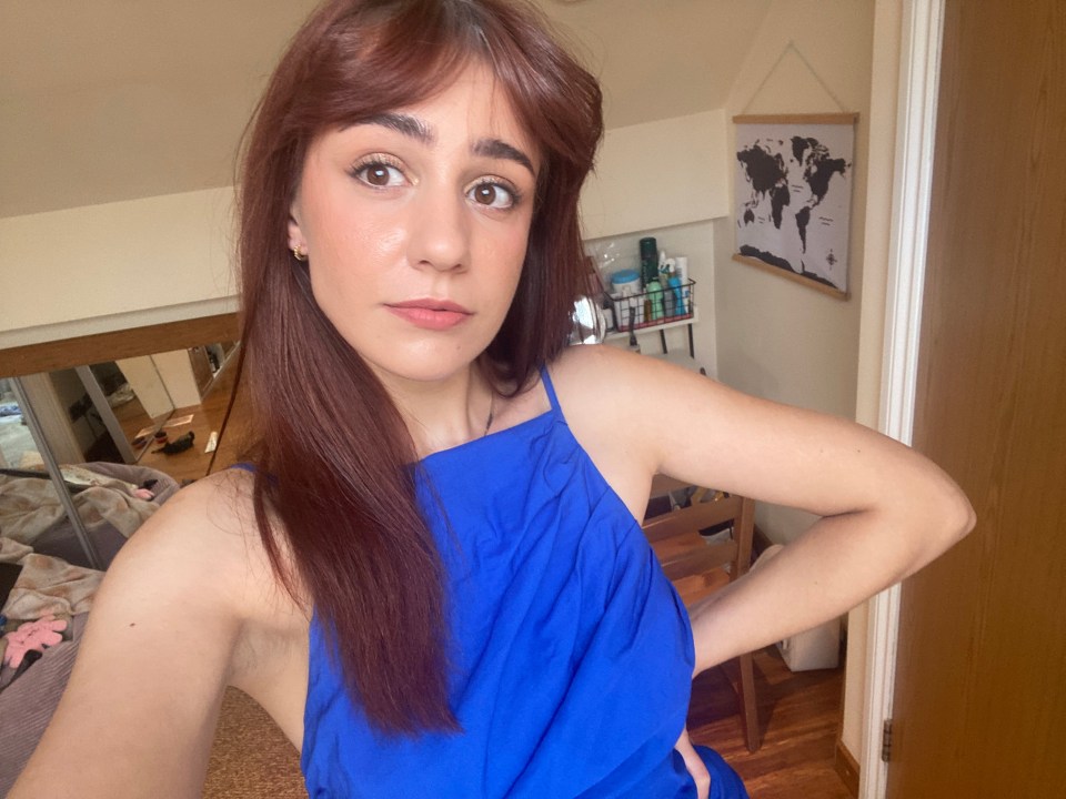 Woman in blue dress near Wimbledon.