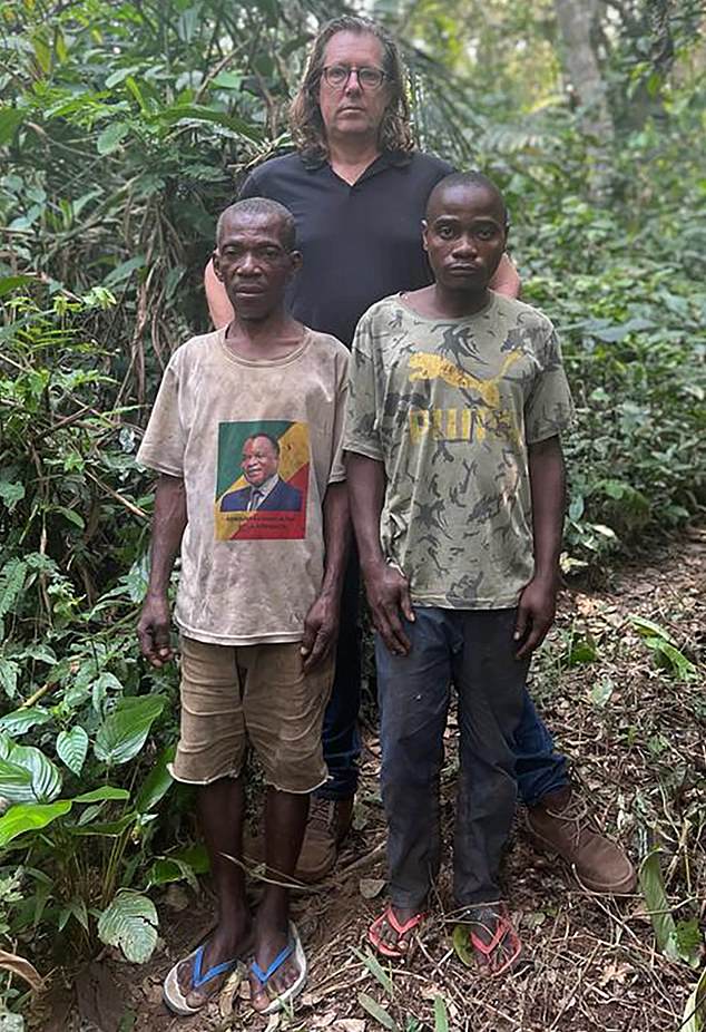 Mail on Sunday reporter Ian Birrell with two Baka men who say they were beaten