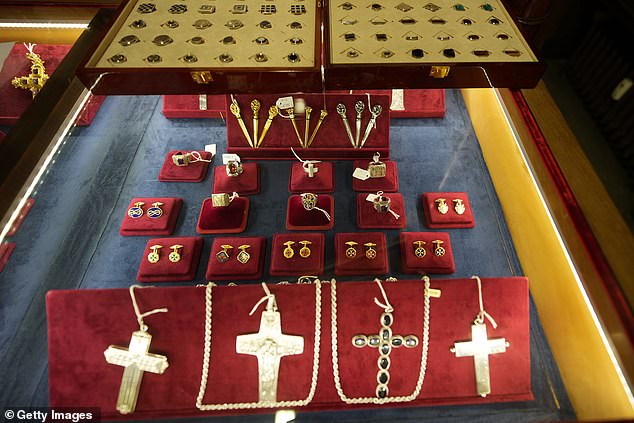 Catholic liturgical jewellery is seen displayed inside the Gammarelli tailor shop, papal tailors since the 1700s, on April 24, 2025 in Rome