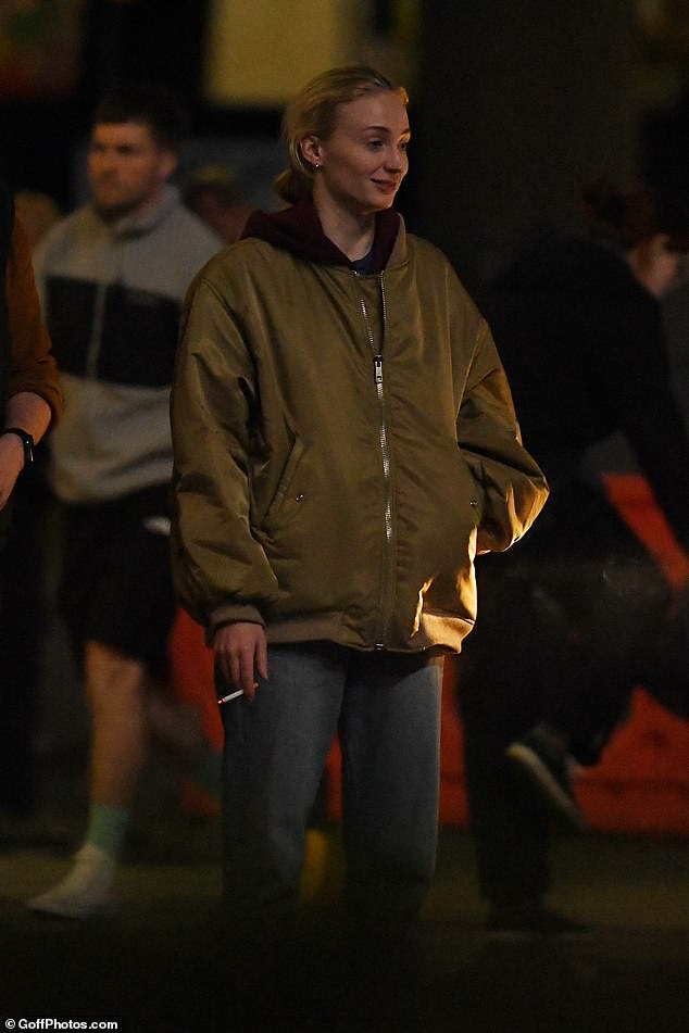 While Sophie Turner said she turned in tobacco cigarettes for vapes, she was pictured taking a cigarette break during filming for thriller Haven in June (pictured)