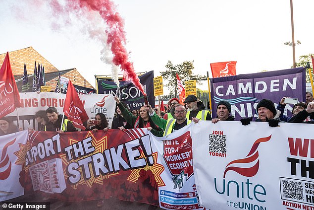 Refuse workers and supporters attend a mass picket and rally at a depot