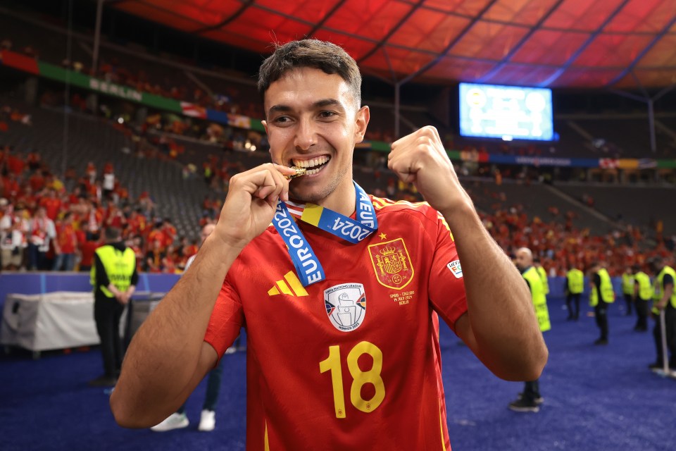 Martin Zubimendi of Spain holding a gold medal after winning the UEFA Euro 2024 final.