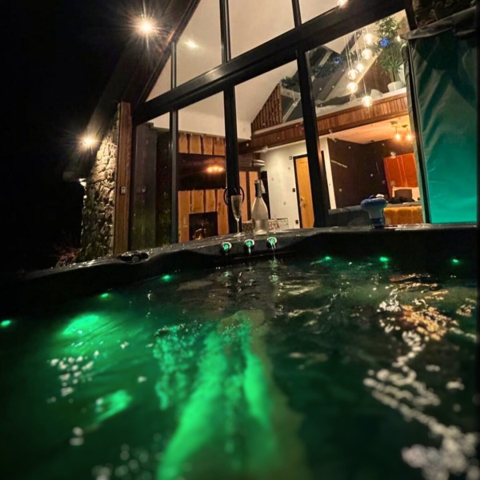 Hot tub at a luxury barn at night.