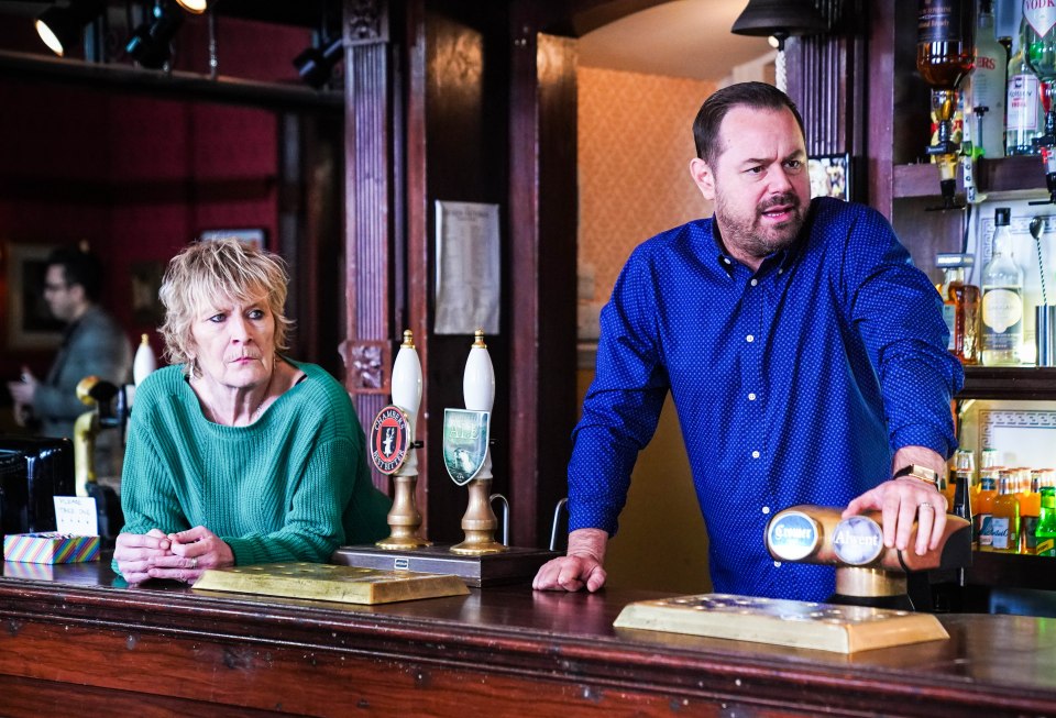 Shirley Carter and Mick Carter behind a pub bar.