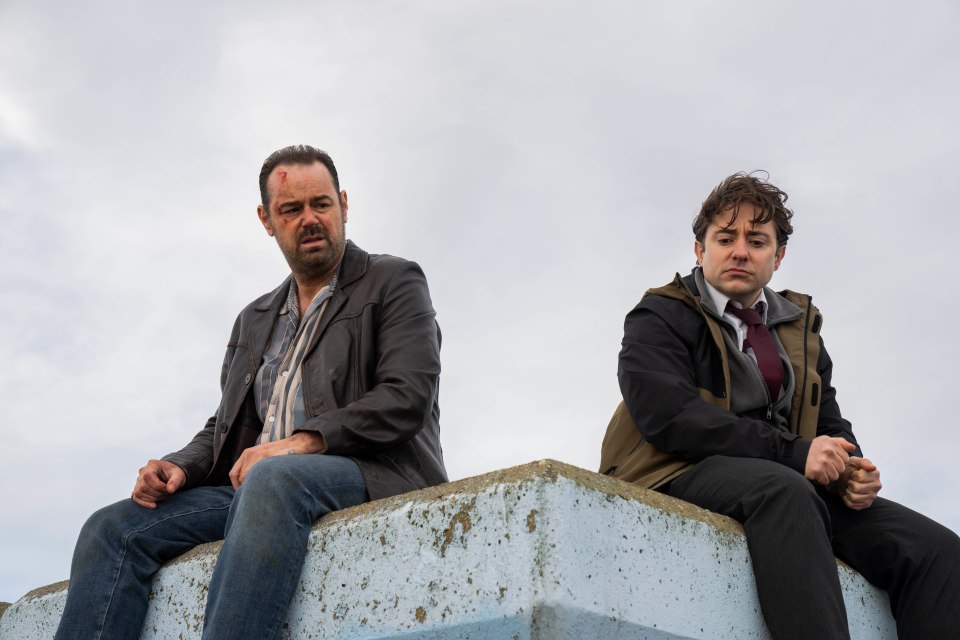 Still from Mr Bigstuff season two, showing Lee and Glen sitting on a wall.