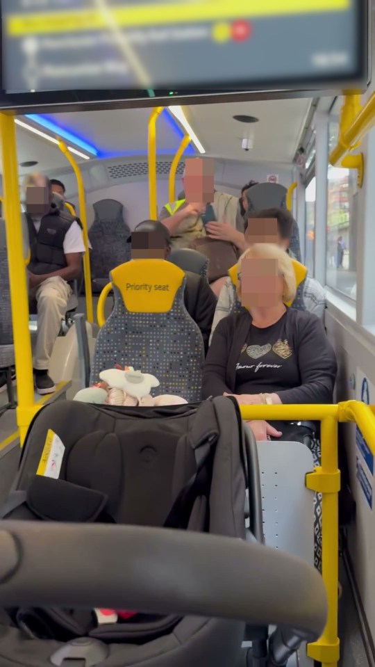 A woman breastfeeding her baby on a bus is confronted by a passenger.