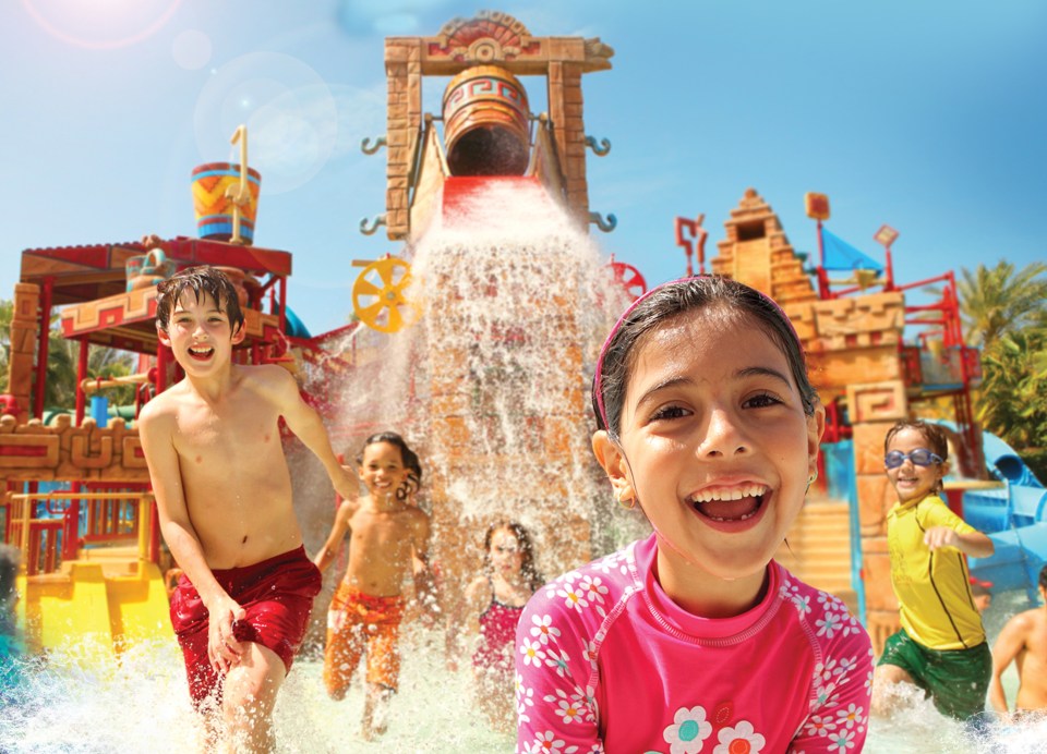 Children playing in a water park.