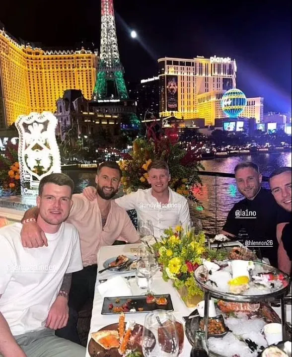 Four men enjoying a meal outdoors in Las Vegas.