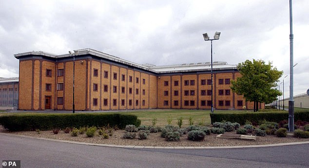 The 18-year-old triple murderer poured boiling water over the officer at HMP Belmarsh (above) in southeast London on Thursday