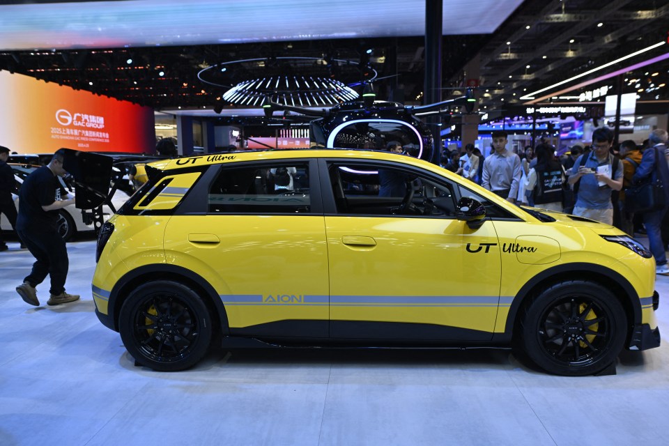 Yellow AION UT Ultra car on display.