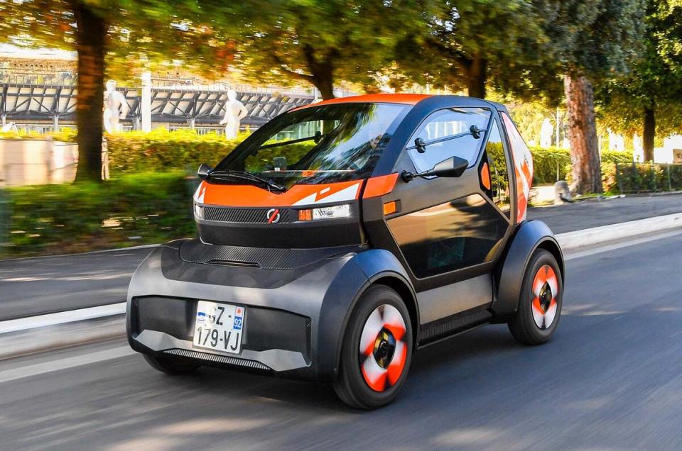 Mobilize Duo electric car driving on a road.