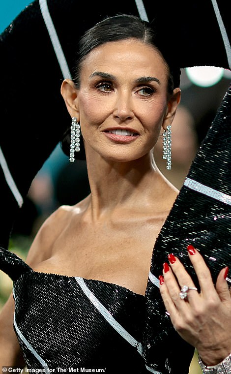 'It's called being human! Nobody's skin is airbrushed in real life even though it looks like it online,' Alexis said. Pictured: Demi Moore at Met Gala