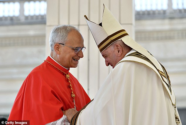 Robert Francis Prevost receives his biretta from Pope Francis as he is elevated in St. Peter's Square at The Vatican in September 2023