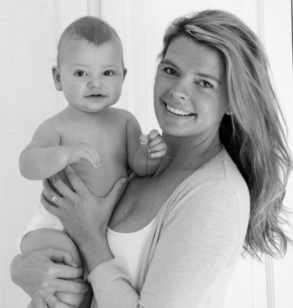Black and white photo of a mother holding her baby.