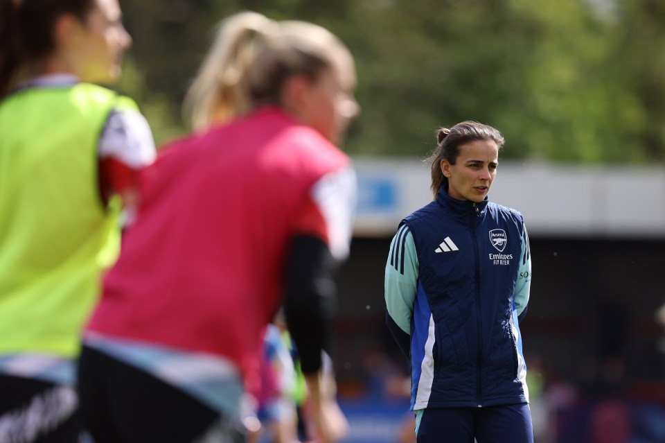 Renee Slegers, Arsenal manager, watching a pre-match warm-up.