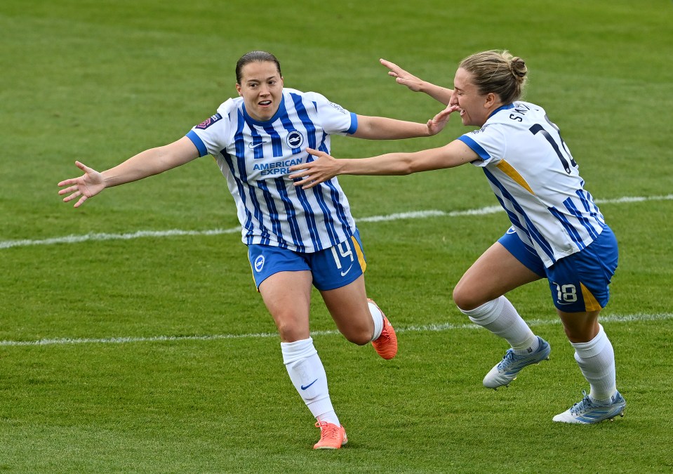 Fran Kirby of Brighton & Hove Albion celebrating a goal with a teammate.