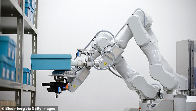 Illustrative image shows a robot arm in use at a factory in Japan. A man at a factory in South Korea was killed on Wednesday, apparently after a robot crushed him against a conveyer belt. The above image does not show the same robot arm involved in the incident in South Korea