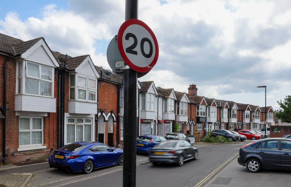 20 mph speed limit sign on a residential street.
