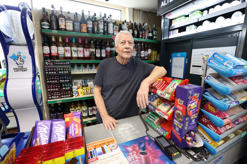 Shopkeeper in a shop on Barrow Island, Cumbria.