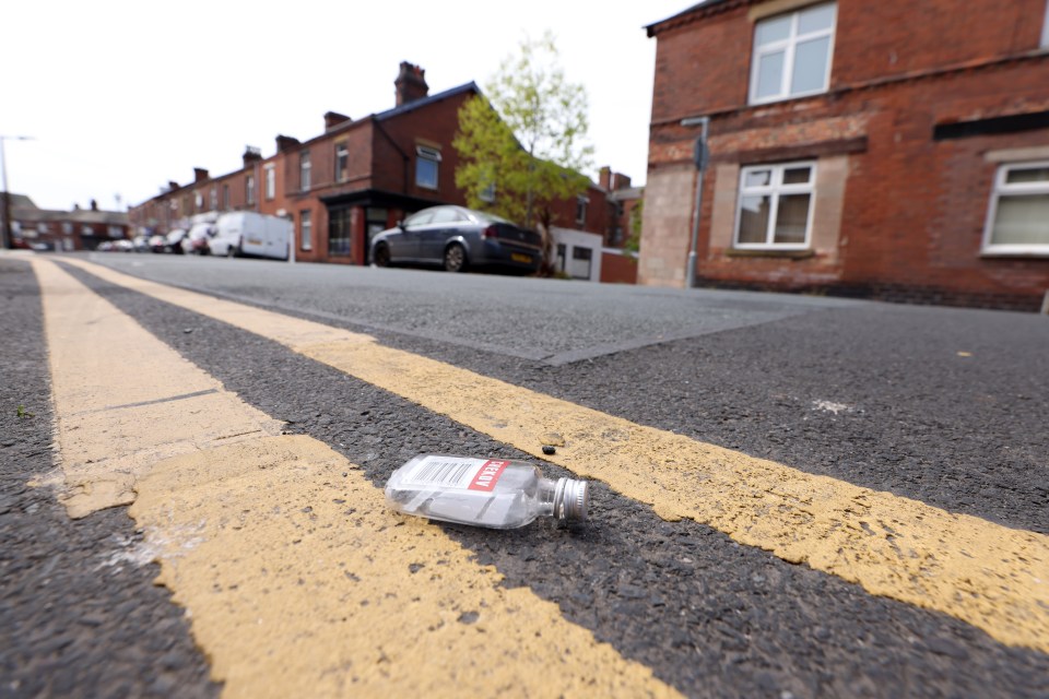 Empty vodka bottle on a street.