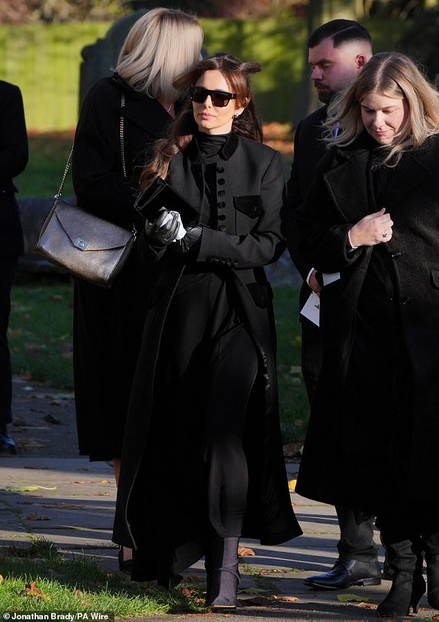 Cheryl walked behind her ex's coffin following a poignant private service attended by family members and a host of stars from the world of music and sport