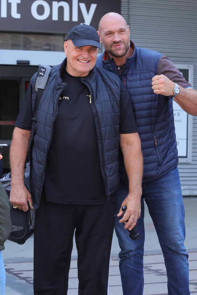 Tyson Fury and his father, John Fury, at an airport.