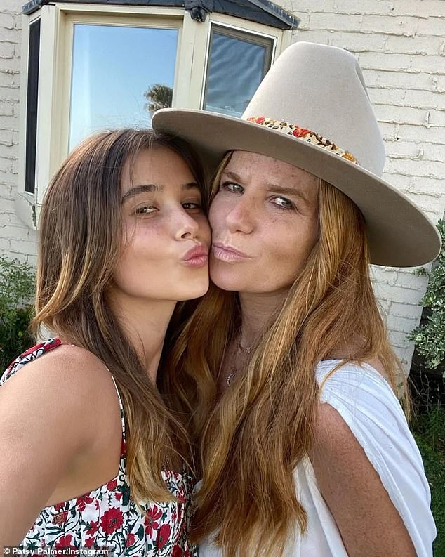 Emilia (pictured with Patsy) is signed to Women Management Los Angeles and from her Instagram, the nepo baby also models for a range of bikini brands