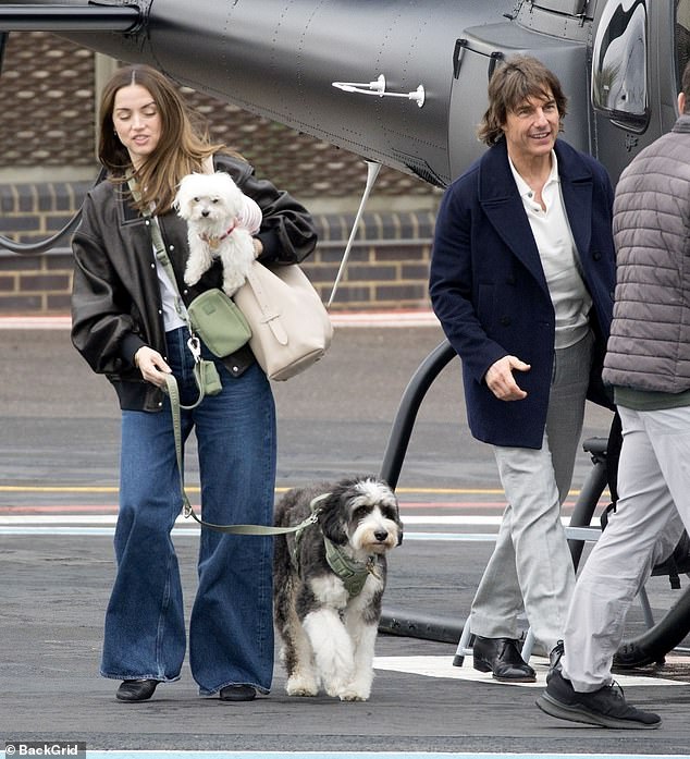 The actress with Cruise and her two dogs pictured in London last month