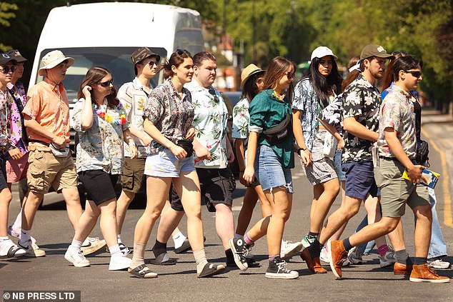 Others, perhaps sensibly dressing for the warmer weather, opted for Hawaiian shirts which they paired with the traditional flower necklace known as a Lei