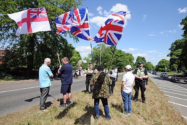 Many were seen waving British and English flags as droves of protesters descended on Aldershot today