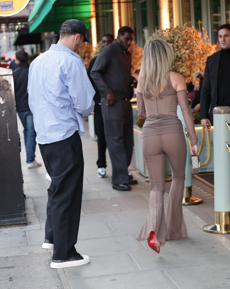 Ashley Roberts and George Rollinson leaving a restaurant.