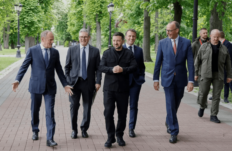 Group of men in suits walking outdoors.