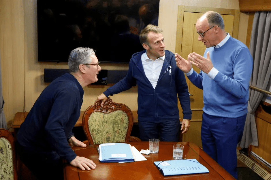 Three men in a meeting.