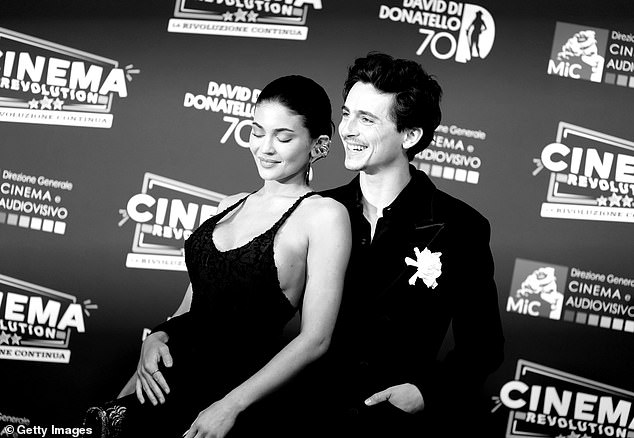 Commenters all wrote about how great each of them look but were divided on whether Kylie was acting more like Timothee's wife or mother while using the lint brush on him