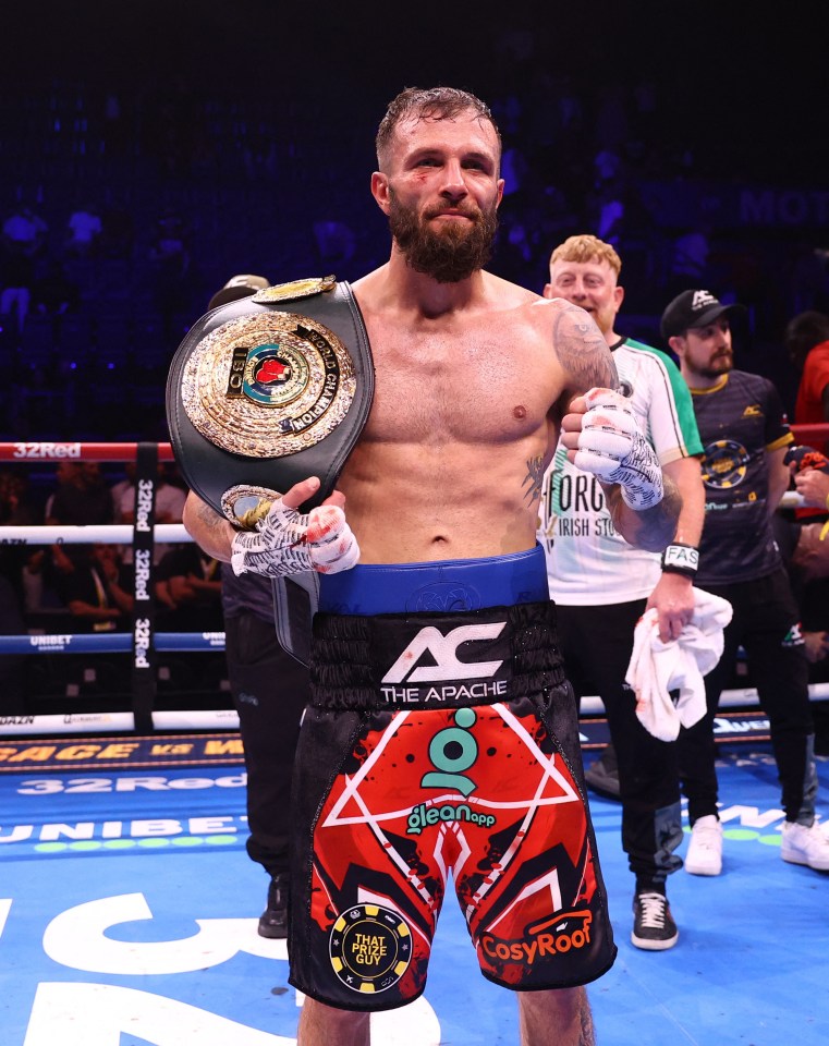 Anthony Cacace celebrates with his IBO World Super Featherweight title belt.