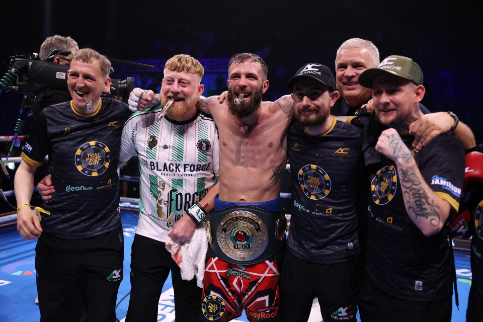 Anthony Cacace with his coaching staff after a boxing victory.