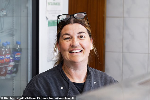 Cheerful and smiling chip shop owner Helen Jones, 51, also believes that working can be an antidote to anxiety and depression