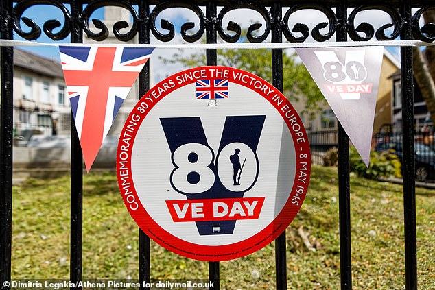 VE Day decorations at the war memorial on Victoria Road, Rhymney, when MailOnline visited
